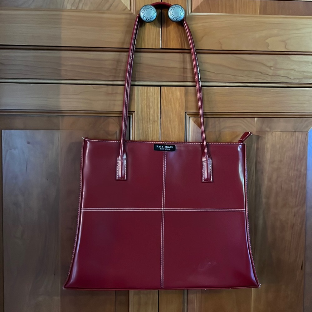 Vintage thin red purse with Kate Spade label.